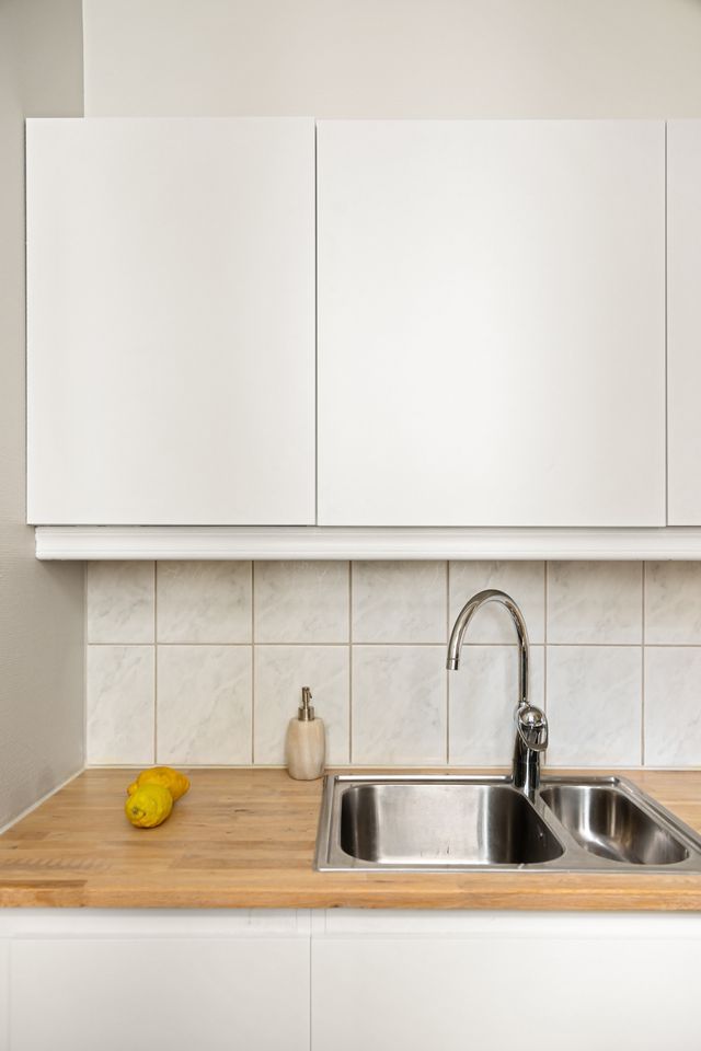 Sparkling clean white kitchen after cleaning